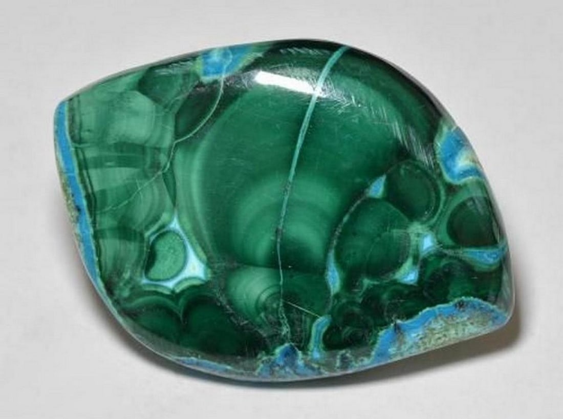 50.32 ct Fancy Cabochon Natural Multicolor Chrysocolla: 50.32 ct Fancy Cabochon Natural Multicolor Chrysocolla Introducing the Fancy Cabochon Natural Multicolor Chrysocolla, a large and vibrant gem showcasing a rich mix of colors in an opaque body. This