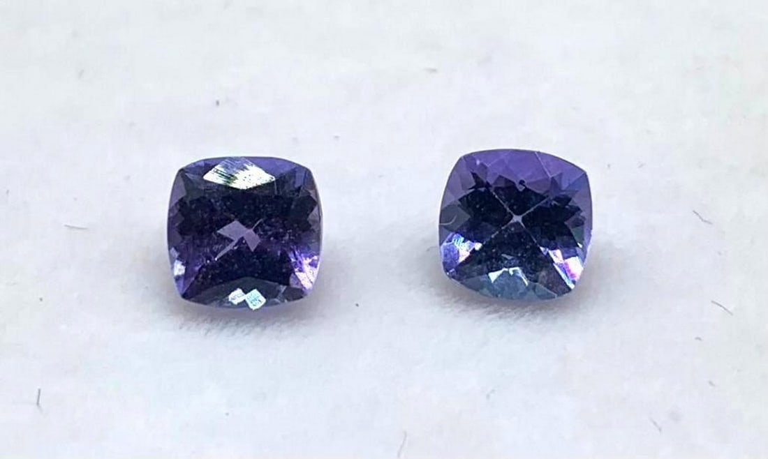 Pair of 2 Cushion Cut Blue Tanzanite Gemstones 0.66 Total Weight: Pair of 2 Cushion Cut Blue Tanzanite Gemstones 0.66 Total Weight Blue Tanzanite are believed to represent heart and intellect combined with intuition and purity. Tanzanite is used to symbolize