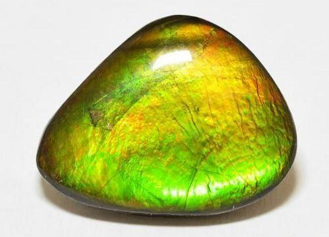 15.27ct Ammolite Cabochon: 15.27ct Ammolite Cabochon Specifications: Type: Ammolite Weight: 15.27 ct Shape: Fancy Cabochon Color: Multicolor Clarity: Opaque Treatment: Assembled Origin: Canada VIew photos for further details.