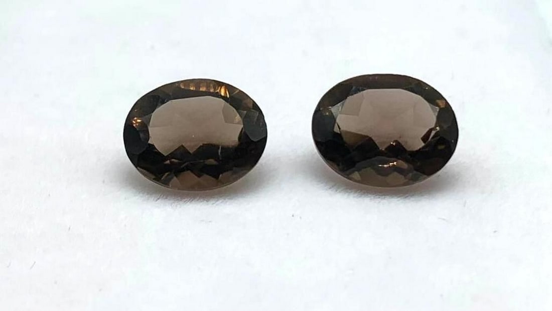 9.1 X 8.2mm Matching Oval Smoky Quartz Pair: 9.1 X 8.2mm Matching Oval Smoky Quartz Pair Quartz enhances spiritual growth, spirituality and wisdom. It clarifies thought processes and emotions, it can increase inspiration and creativity. It can a