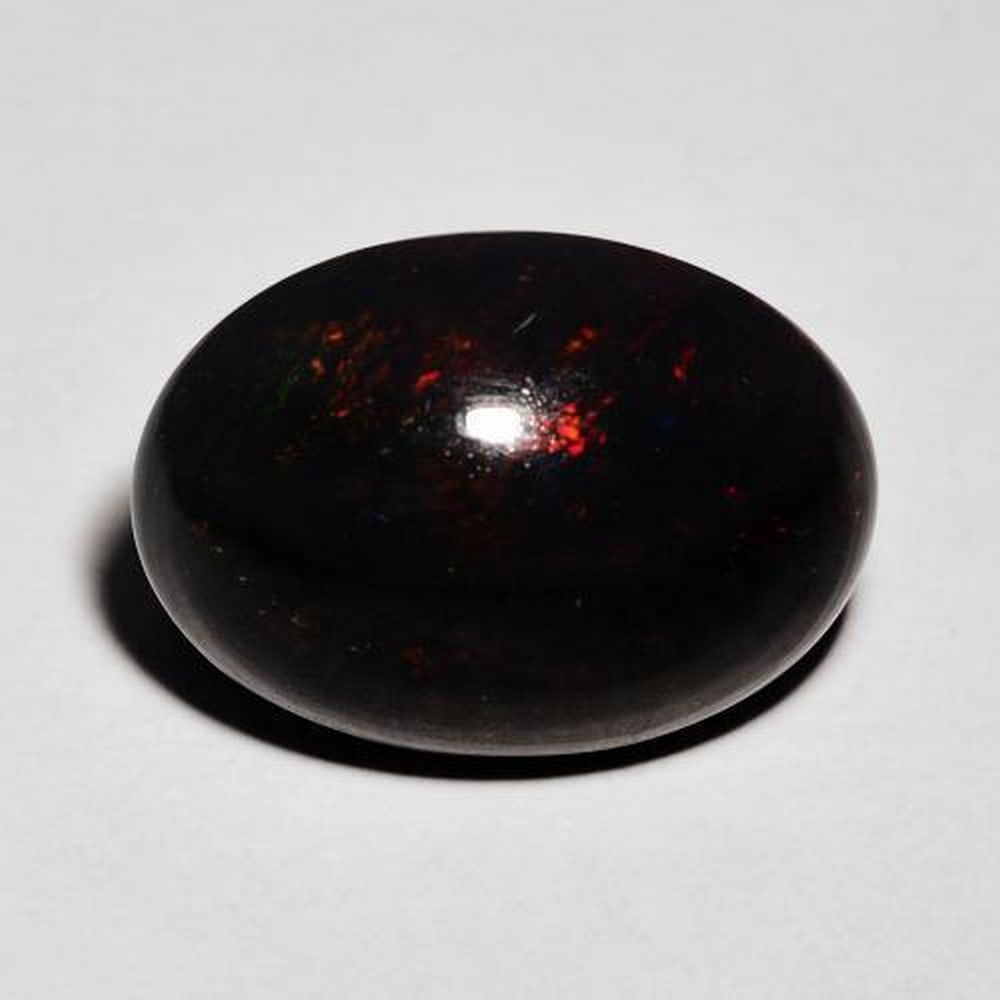 4.32ct Multicolor Black Oval Opal Gemstone: 4.32ct Multicolor Black Oval Opal Gemstone Type: Black Opal Size: 15.7 x 11.6mm Colour: Multicolor Treatment: Smoked Clarity: Opaque Origin: Ethiopia Mohs Hardness: 5.5- 6.5 View Photos For Further