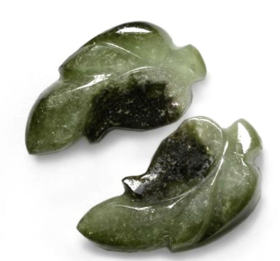 11.44ct Green Leaf Loose Tourmaline Pair of Gemstones: 11.44ct Green Leaf Loose Tourmaline Pair of Gemstones Total Weight: 11.44ct Individual Weight: 5.73ct Size: 19.05mm L x 10.3mm W x 3.8mm D Shape: Carved Leaf Color: Deep Green Clarity: Translucent