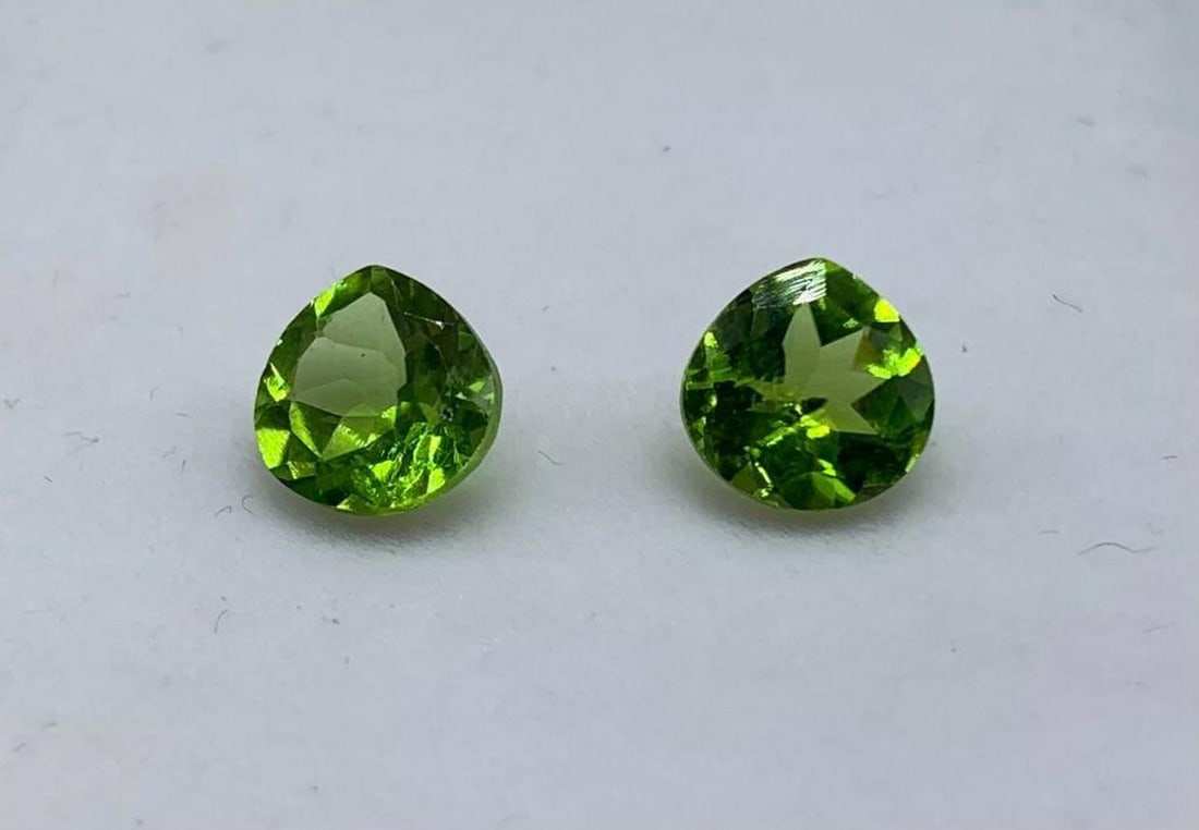 4ct Pear Tear Drop Cut Green Apple Peridot Pair: 4ct Pear Tear Drop Cut Green Apple Peridot Pair Size: 7.8mm x 7.8mm Total Carat Weight: 4.00ct Untreated Lot Contains 2 Gems Bright green hues and great clarity make this stone a great addition to