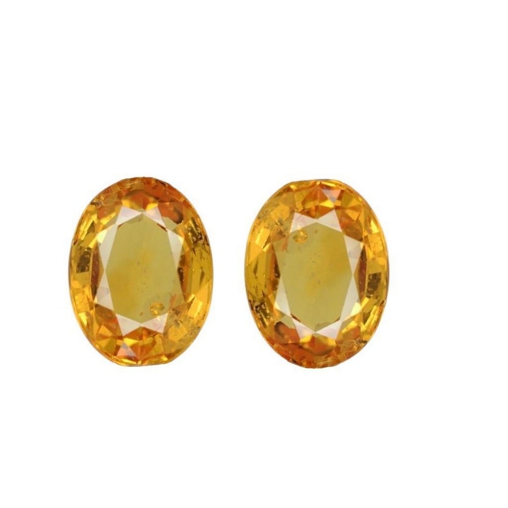 1.4ct Oval Cut Orange Yellow Sapphire Pair: 1.4ct Oval Cut Orange Yellow Sapphire Pair Size: 5.9 x 4.1mm Total Carat Weight: 1.4ct Treated: Yes Lot Contains 2 Gemstones This coloration of sapphire is known as "fancy" and comes in a wide