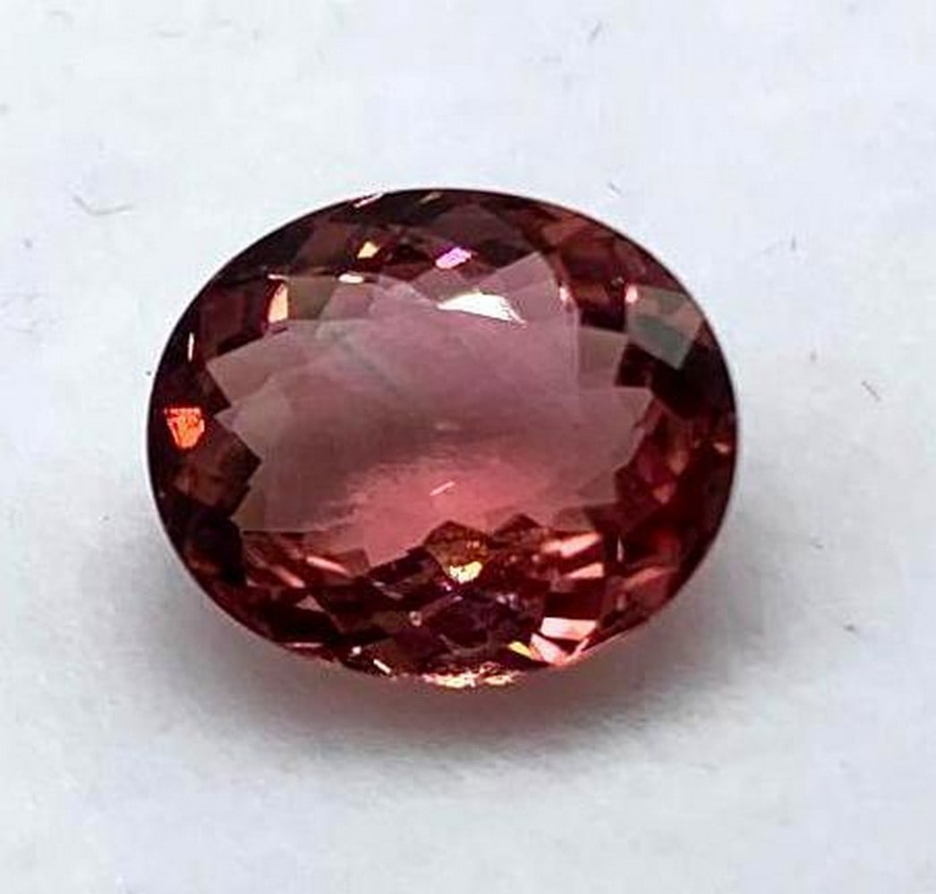 3.25ct Oval Floral Cut Pink Tourmaline Gemstone: 3.25ct Oval Floral Cut Pink Tourmaline Gemstone Size: 10.3 x 8.9mm Total Carat Weight: 3.25ct Untreated Great stone with deep pink hues making it perfect for a center piece in any jewelry item. Please
