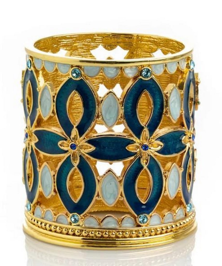 Royal Glow Gold and Blue Candle Holder: Royal Glow Gold and Blue Candle Holder Infuse your space with regal charm using this gold and blue candle holder. The rich blue hue offers a striking contrast to the luminous gold accents, creating a