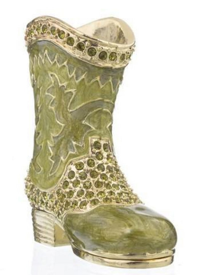 Swashbuckler's Green Boot Trinket Box: Swashbuckler's Green Boot Trinket Box This whimsical trinket box takes the form of a swashbuckling green musketeer boot, complete with a turned-up toe, golden accents, and a flourish of feathered