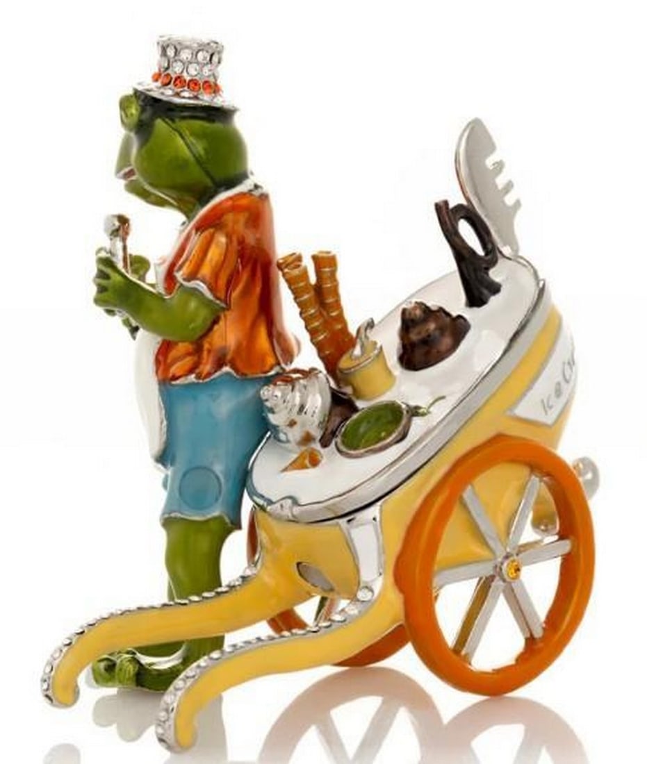 Ice Cream Frog Delight Trinket Box: Ice Cream Frog Delight Trinket Box Brimming with whimsy, this delightful trinket box features a cheerful frog dressed as an old-fashioned ice cream vendor, complete with a cart full of sweet treats.