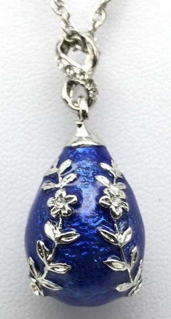 Deep Blue Egg Pendant Necklace: Deep Blue Egg Pendant Necklace Capture the calm and mystery of the ocean with this deep blue egg pendant necklace. Its rich enamel finish shines with a vibrant, polished glow, suspended from a