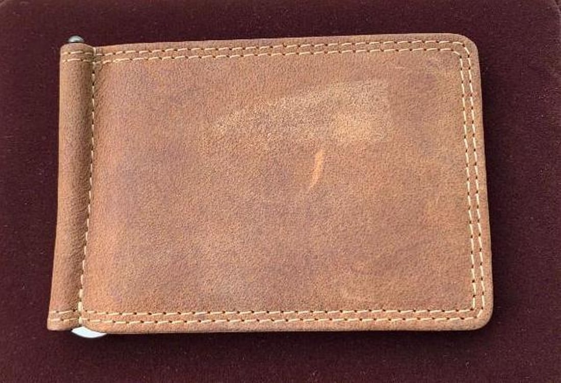 Genuine Bison Leather Wallet: Genuine Bison Leather Wallet Crafted from bison leather, this wallet blends rugged durability with refined craftsmanship. Known for its distinctive grain and exceptional strength, bison leather ages