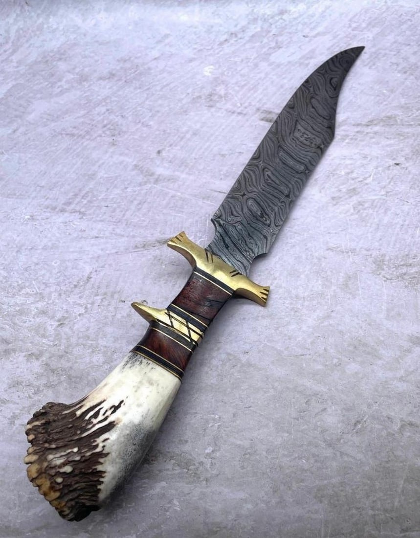 A Bone Handle Brass Insert Custom Designed Damascus Hunting Blade: A Bone Handle Brass Insert Custom Designed Damascus Hunting Blade. High Quality steel is utilized to forge the finest product in the world. Unique Custom Hand-Forged Damascus Steel Bowie Blade Constru