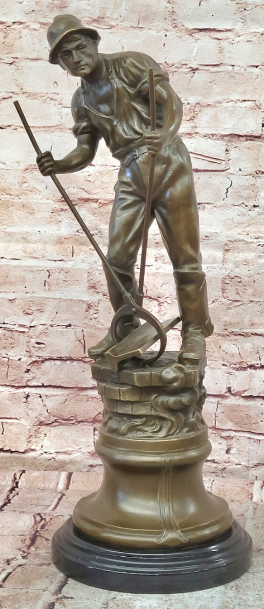 Forge Worker Bronze Sculpture by Mavchi - 22.5'' x 8'': Forge Worker Bronze Sculpture by Mavchi - 22.5" x 8" Introducing a Bronze Sculpture: This depiction of a male forge worker is handcrafted with attention to detail. The figure is shown in a