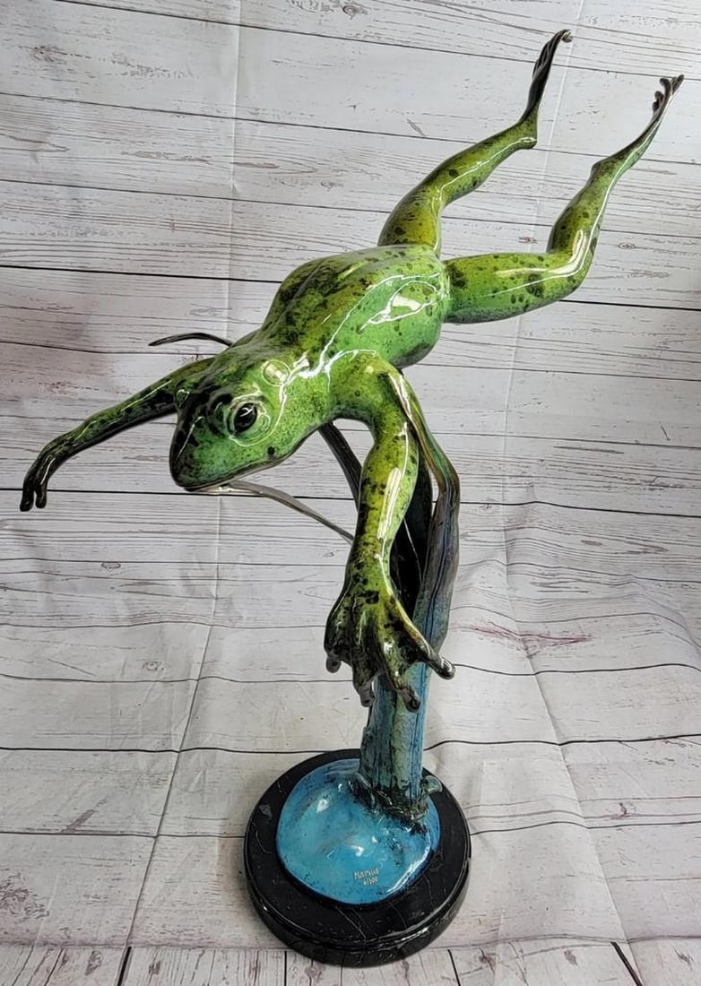 Abstract Leaping White-Lipped Tree Frog Sculpture by Marius - 26'' x 24'': Abstract Leaping White-Lipped Tree Frog Sculpture by Marius - 26" x 24" Witness the dynamic motion of a white-lipped tree frog captured in an abstract form with this exquisite sculpture. Frozen