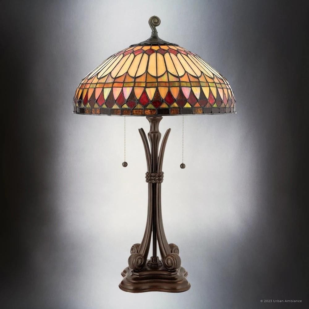 Luxury Mediterranean Tiffany Table Lamp: Luxury Mediterranean Tiffany Table Lamp Bring warmth and elegance into your home with this Mediterranean-inspired Tiffany Table Lamp. Its umbrella-shaped stained glass shade, crafted with vibrant piec
