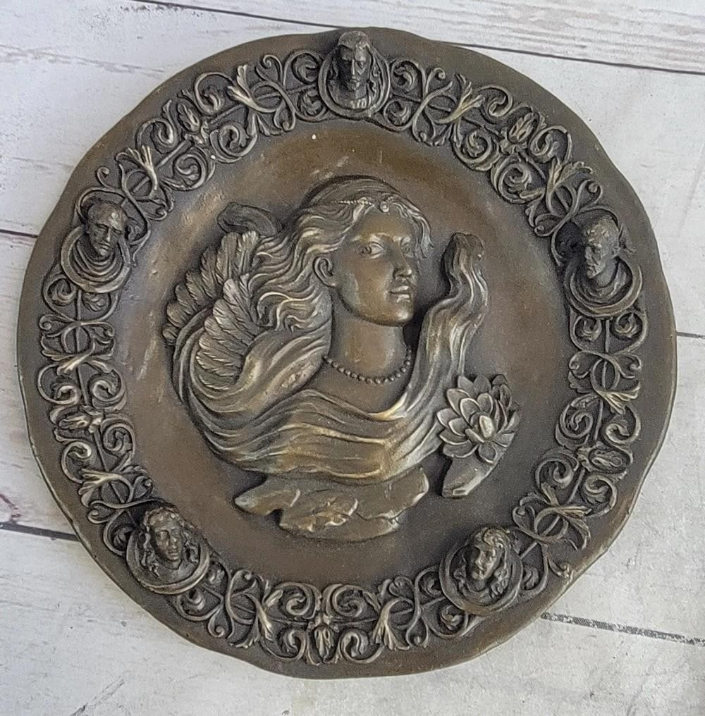 Bronze Wall Art of Young Woman with Blossoming Flowers by Jean Patoue - 8.5'' x 8.5'': Bronze Wall Art of Young Woman with Blossoming Flowers by Jean Patoue - 8.5" x 8.5" This stunning bronze wall art features the solemn profile of a young woman, her expression serene and her hair