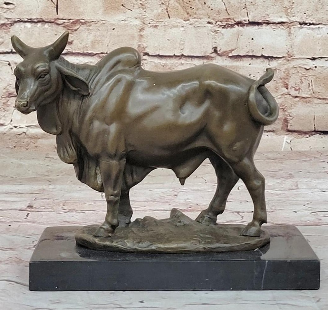 Zebu Cattle Bronze Sculpture by Juno - 16'' x 17.5'': Zebu Cattle Bronze Sculpture by Juno - 16" x 17.5" Celebrate the resilience and beauty of the Zebu with this lifelike bronze sculpture by Juno. Known for their distinctive humped shoulders, droo