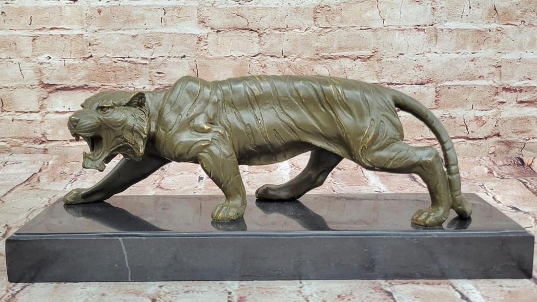 The Tiger - Inspired Bronze Sculpture by Barye - 7'' x 16'': The Tiger - Inspired Bronze Sculpture by Barye - 7" x 16" The Tiger bronze sculpture by Barye is a commanding piece that captures the majestic essence and raw power of one of nature's most rever