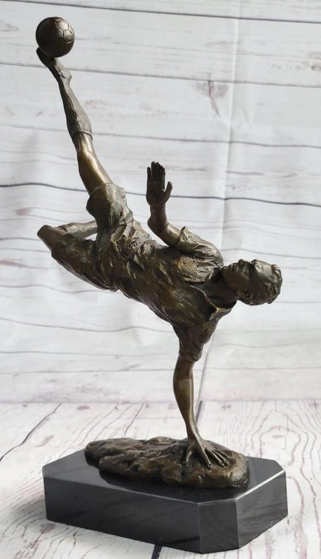Signed Milo Original Soccer Trick Shot Bronze Sculpture - 14'' x 10'': Signed Milo Original Soccer Trick Shot Bronze Sculpture - 14" x 10" They are legend on the field. A soccer player tumbles down the grassy field, kicking, and dodging along the way. He is swift o