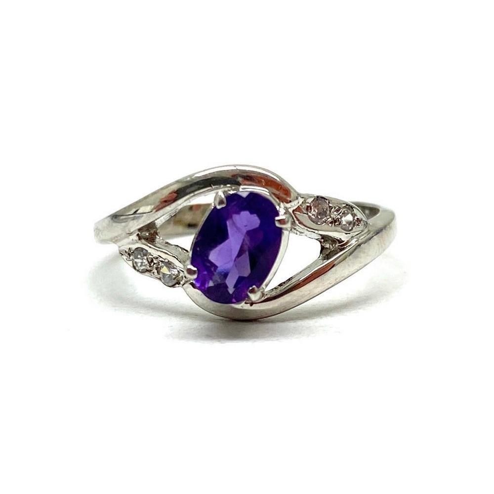 925 Sterling Silver Ring with Austrian Crystals and a Beautiful Amethyst Gemstone: 925 Sterling Silver Ring with Austrian Crystals and a Beautiful Amethyst Gemstone. The crystals represent purification and connection to spiritual and divine beings. The meaning of amethyst is attache