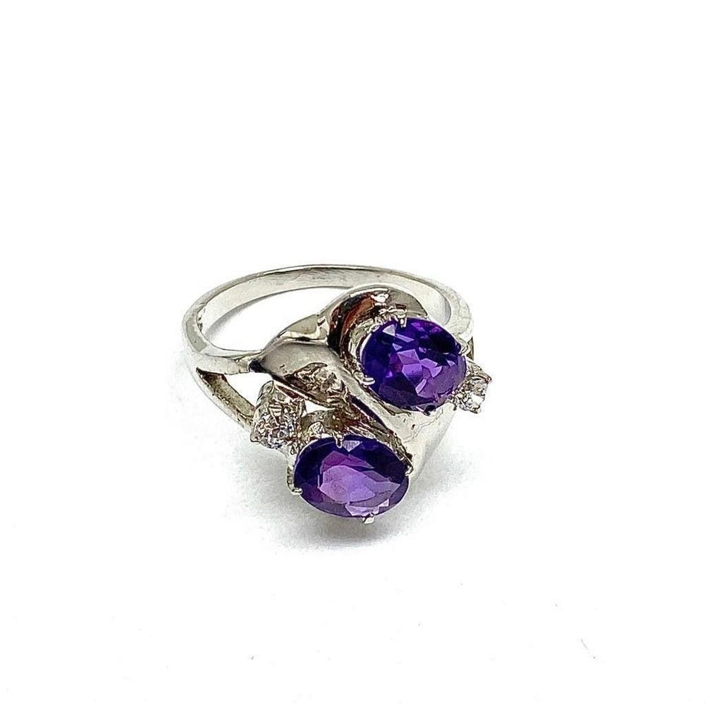 925 Sterling Silver Ring with Double Amethyst Gemstones and Austrian Crystals: 925 Sterling Silver Ring with Double Amethyst Gemstones and Austrian Crystals. The crystals represent purification and connection to spiritual and divine beings. The meaning of amethyst is attached to