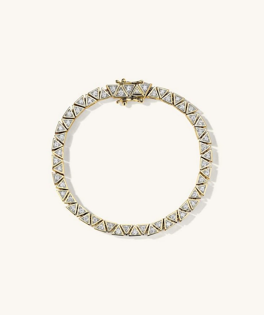 14k Yellow Gold Patra Diamond Tennis Bracelet: 14k Yellow Gold Patra Diamond Tennis Bracelet In a league of its own. Make a bold statement with pieces handcrafted in 14k gold and adorned with responsibly sourced diamonds. Details: - Average Carat