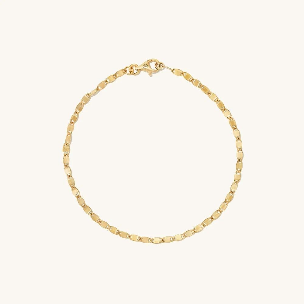 14k Yellow Gold Anchor Chain Bracelet: 14k Yellow Gold Anchor Chain Bracelet A sleek chain with bold styling potential. Handcrafted in 14k solid gold, its interlocking links evoke the strength of a ship s anchor chain. When properly cared