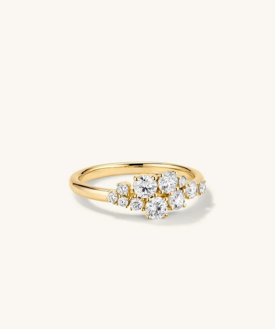 14k Yellow Gold Diamond Burst Ring: 14k Yellow Gold Diamond Burst Ring The asymmetric shape and organic design set this milestone ring apart from the rest. Featuring eleven diamonds in prong settings, it's crafted to become an heirloom 