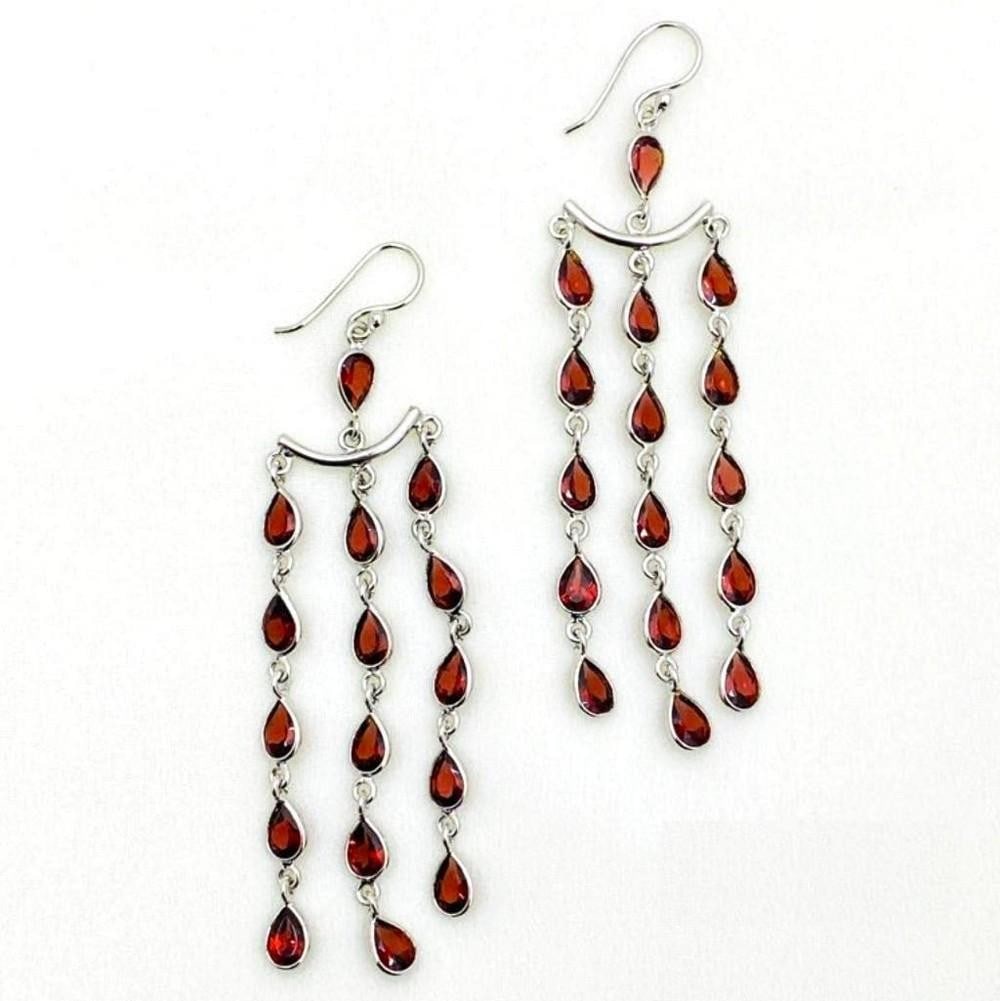 Garnet Pears 3 Row Dangle Earrings: Garnet Pears 3 Row Dangle Earrings Each earring in this 925 Sterling Silver pair features 3 rows of red garnet pears dangling down from one after the other. View Photos For Further Details.