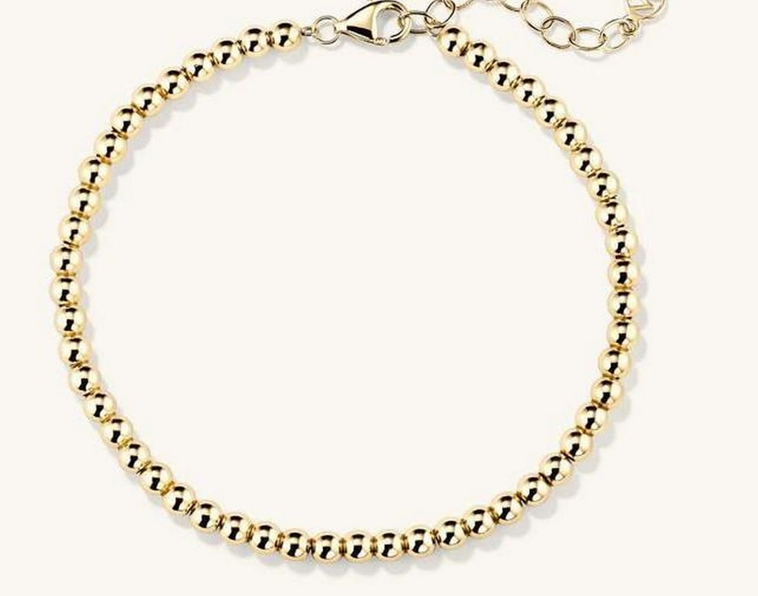 Golden Breeze Bracelet: Golden Breeze Bracelet. This hollowed 14k gold bracelet is a stunning embodiment of lightness and elegance. Its design creates a graceful, airy feel, while maintaining a bold presence. This piece