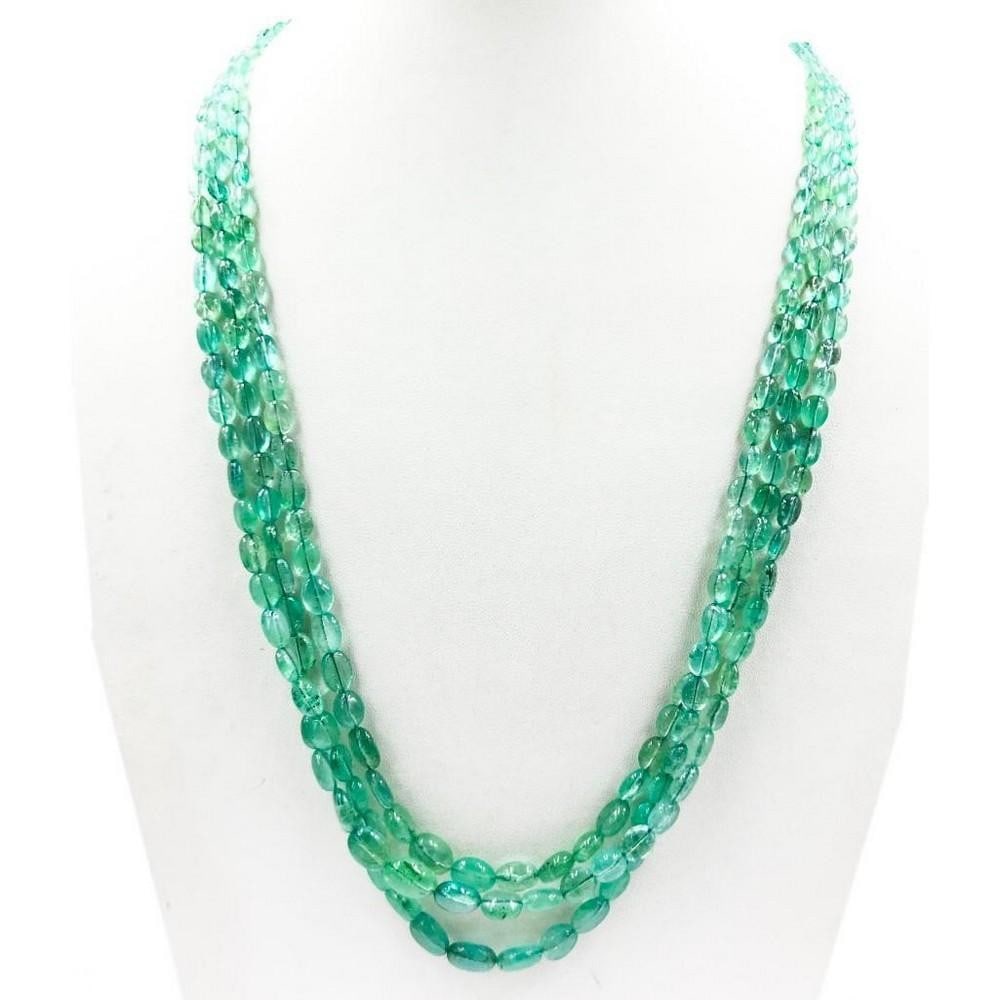 Triple String Emerald Plain Bead Necklace: Triple String Emerald Plain Bead Necklace A triple stranded plain emerald beaded string necklace. Length of necklace- 46 cms, Weight in Carats- 252ct View Photos For Further Details.