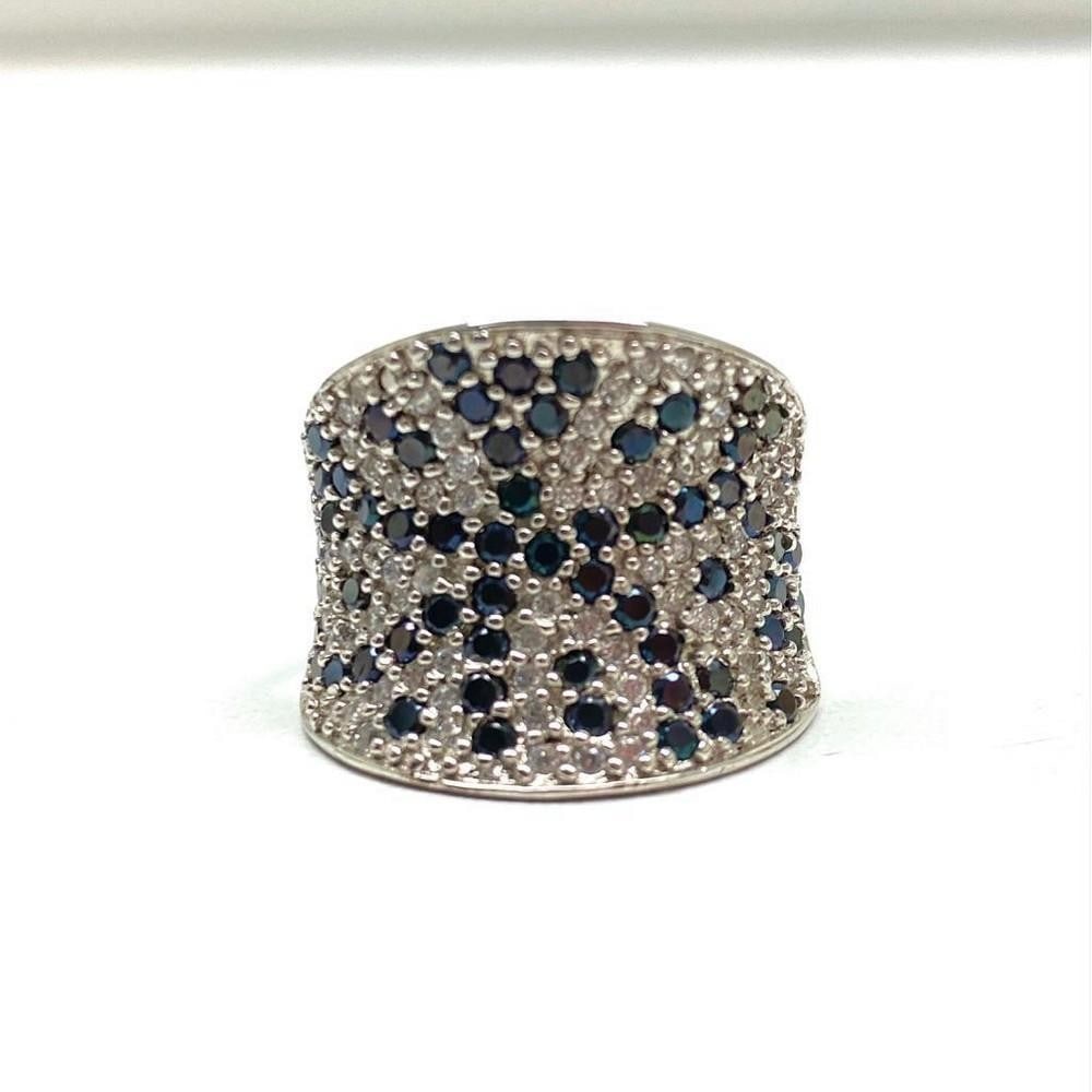 Ladies Simulated Diamond Ring with 925 Sterling SIlver Mount: Each stone in this unique ring is a round cut, Bianco diamond, and is at a carat weight of 1/2. The Cluster of Bianco diamonds and blue cut stones draws the attention of the eye with glimmer and
