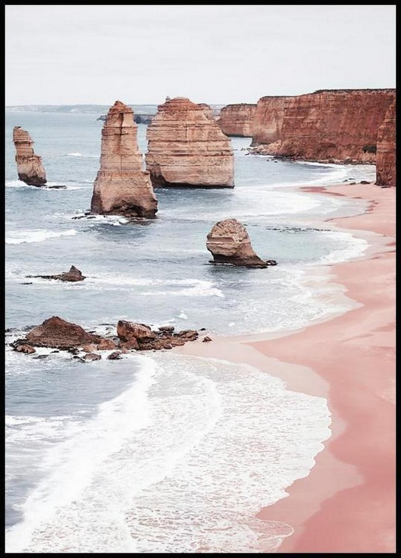 Twelve Apostles Beach Poster: Twelve Apostles Beach Poster A photograph from above with brown apostles on the beach. The sand is pink and the ocean is blue. You can almost hear the wind and the waves from the ocean by looking at