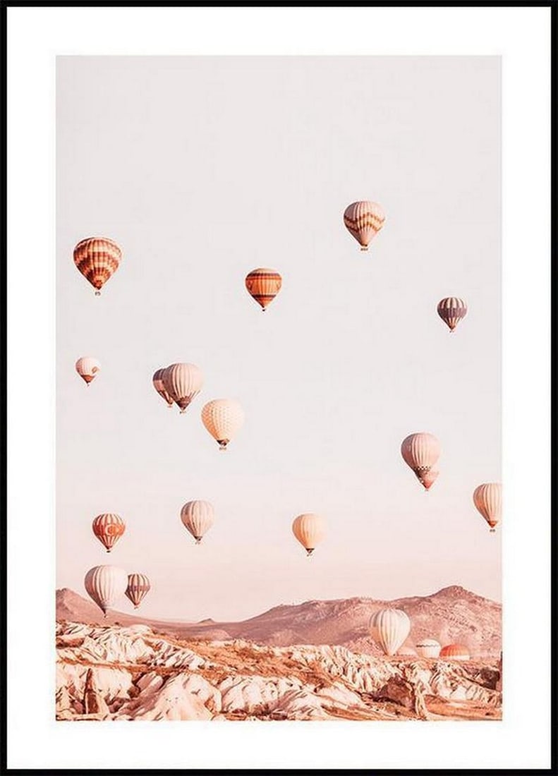 Hot Air Balloons Poster: Hot Air Balloons Poster Photo art poster in soft pastel tones with a dreamy motif of colourful hot air balloons which drift freely over pointy mountain tops towards the light blue sky. The poster has