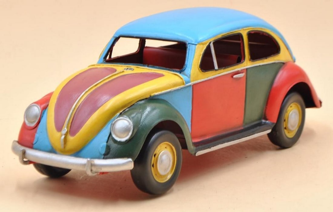 1934 Volkswagen Beetle Rainbow 1/12 Diecast Model Car: 1934 Volkswagen Beetle Rainbow 1/12 Diecast Model Car Key features: Decoration & parts comes with stickers to match your scene, Plastic die-cast metal, Ultra-precision design with some moving parts (w