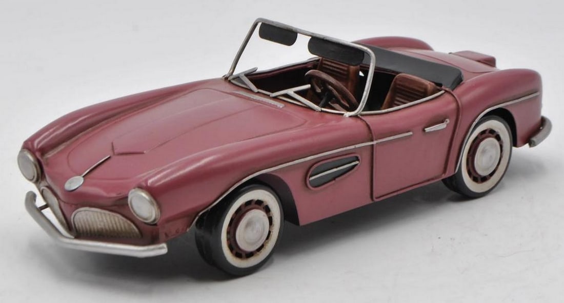 Burago 1: 12 Scale Diecast Model: 1957 BMW 507 Convertible - Rose / Brown: Burago 1: 12 Scale Diecast Model: 1957 BMW 507 Convertible - Rose / Brown Add a sporty touch to your table, desk, or shelf with this 1957 BMW 507 Convertible model. Crafted with a rustic iron frame, i