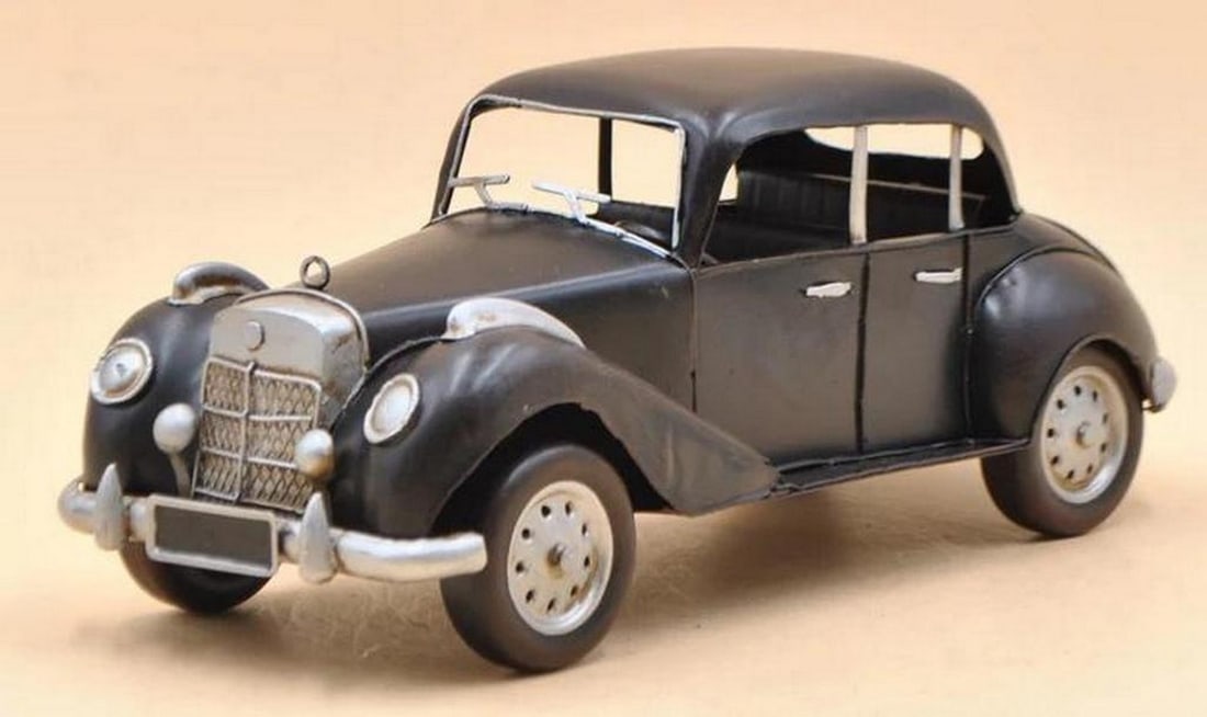 1955 Black Mercedes Benz 1: 12 Diecast Artwork by Jayland USA: 1955 Black Mercedes Benz 1: 12 Diecast Artwork by Jayland USA Enhance any tabletop, desk, or shelf with our rustic 1955 Mercedes Benz 300 car, introducing a sporty touch to your decor. This vintage cl