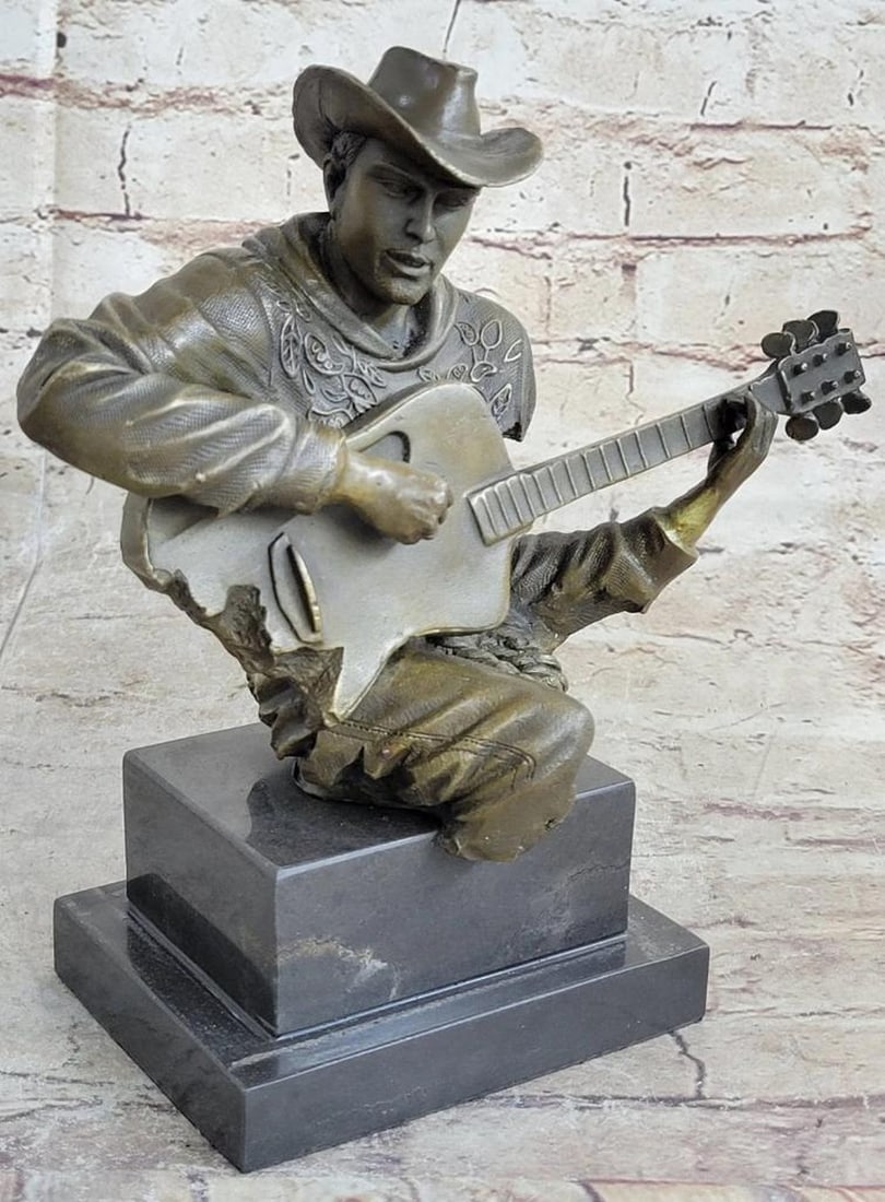 Country Western Music Musician Guitar Player Jazz Bronze Figurine Statue: This amazing and creative Detailed of a cowboy musician playing his Guitar is exquisite. He is made with the creation of your imagination. His eyes are concentrating on each string he touches, making 