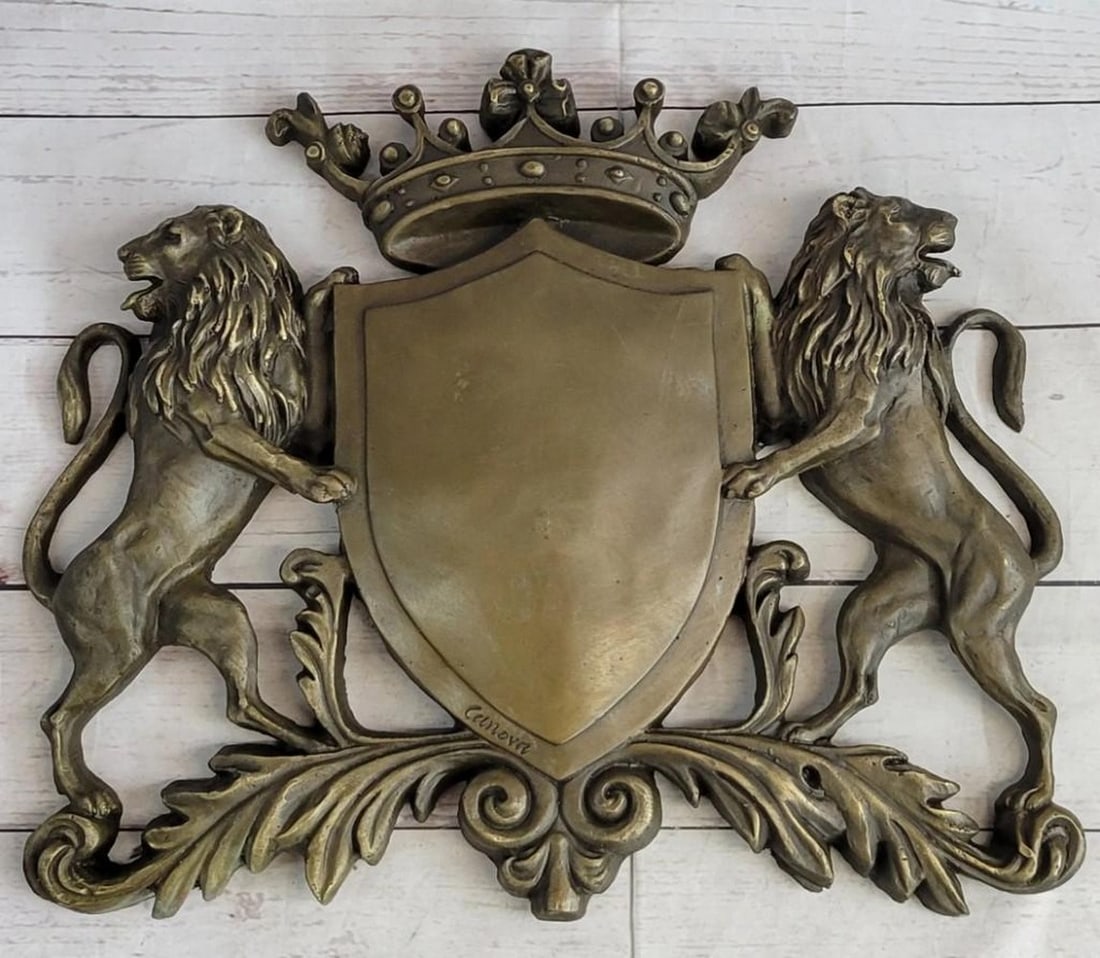 Lion & Crown Coat of Arms Family Crest Bronze Sculpture: Lion & Crown Coat of Arms Family Crest Bronze Sculpture This amazing piece that would go lovely as a family traditional crest describes the power behind a shield and two lions, they were use as a way 