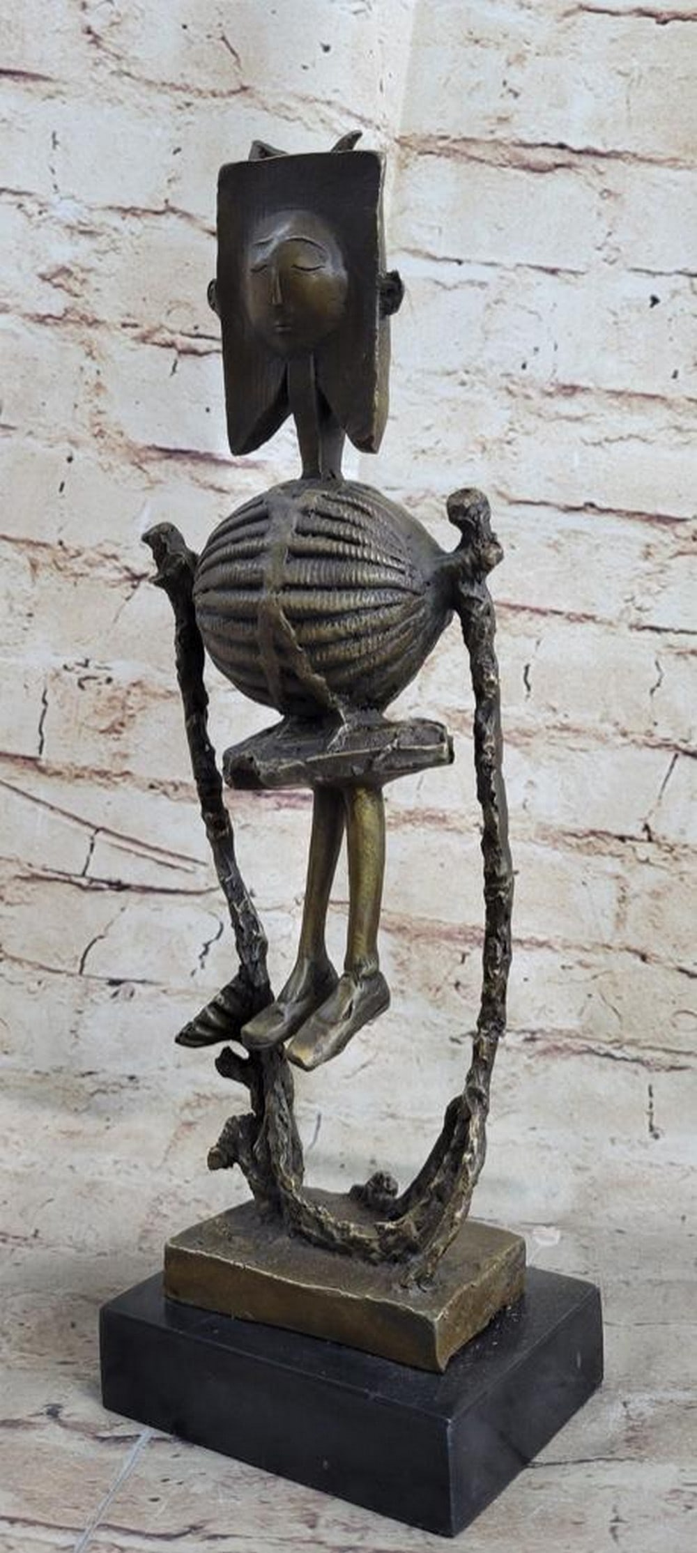 Robot Skeleton Bronze Statue Sculpture: Robot Skeleton Bronze Statue Sculpture This abstract sculpture is a great conversation piece. There is profile of a person is smoothly carved onto a stone rock. The contradicting style of the smooth, 