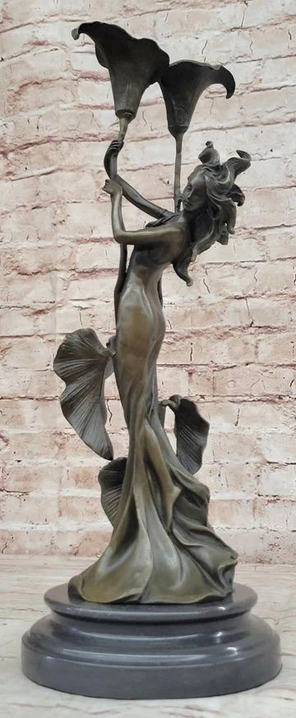 The Art Deco Elegance of the Goddess of Beauty Bronze Statue - 15'' X 6'': The Art Deco Elegance of the Goddess of Beauty Bronze Statue - 15" X 6" Behold the exquisite bronze masterpiece, " Tulip Young Girl Candlestick," a sublime creation within the realm of Art