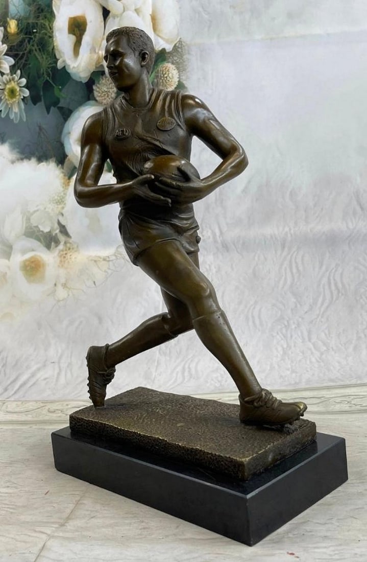 Australian Player in Rugby World Cup Bronze Sculpture: Australian Player in Rugby World Cup Bronze Sculpture A muscular Rugby player runs for the end field, trying to skip the yards and avoid being tackled. His powerful legs ache as he sprints and dodges.