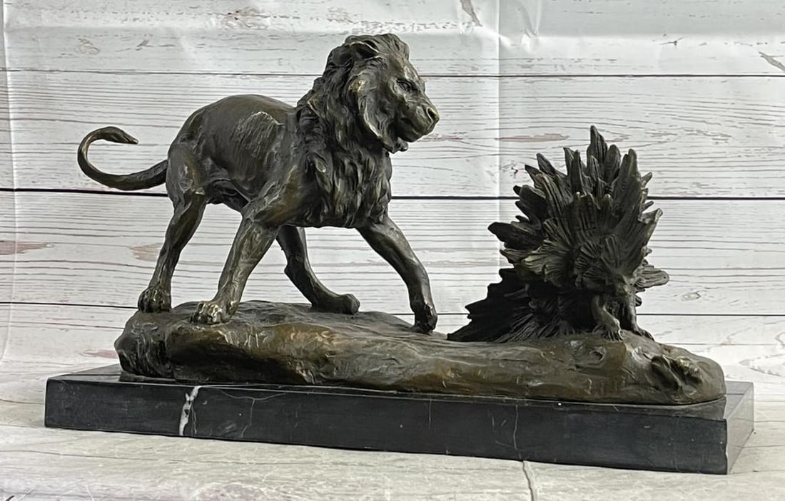 Signed Milo Original Lion vs. Porcupine Bronze Sculpture on Marble Base - 10'' x 16'': Signed Milo Original Lion vs. Porcupine Bronze Sculpture on Marble Base - 10" x 16" Witness the gripping encounter between a powerful lion and a resilient porcupine in this extraordinary bronze 
