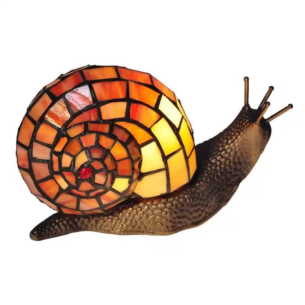 Whimsical Snail Tiffany Accent Lamp: Whimsical Snail Tiffany Accent Lamp Discover the charm of nature-inspired design with our Whimsical Snail Accent Lamp, inspired by L.C. Tiffany s love of the garden snail. The lamp s shade is fashione