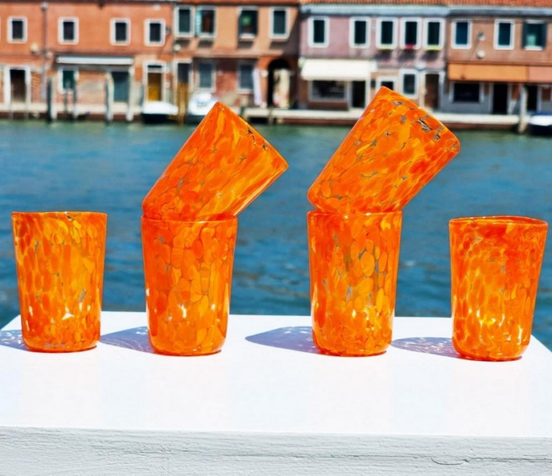 Set of 6 Orange Limoncello Drinking Glasses - Murano Glass: Set of 6 Orange Limoncello Drinking Glasses - Murano Glass Enhance your table with this set of 6 blown glasses, crafted from Murano Glass. The vibrant orange color adds a lively touch, perfect for