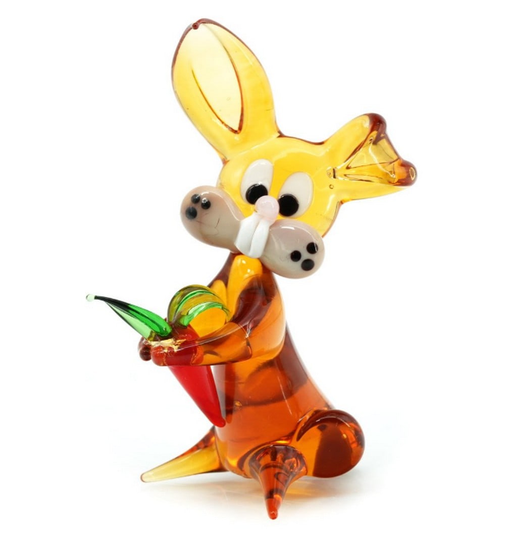 Murano Glass Amber Rabbit Miniature: Murano Glass Amber Rabbit Miniature This charming amber rabbit miniature is a delicate handcrafted sculpture made using traditional lampworking techniques by Murano glass masters Dimensions: Length: