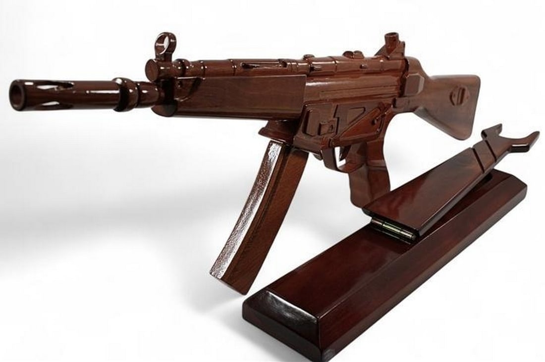 Wooden MP-5 Gun Replica: Wooden MP-5 Gun Replica If you re looking for that very special gift or award, then this is it. Handcrafted from solid mahogany and given three coats of polyurethane to give it a durable high gloss