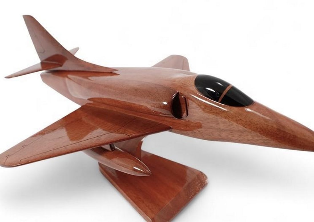 A-4 Skyhawk Wooden Model: A-4 Skyhawk Wooden Model The Skyhawk has been recreated in solid mahogany by expert artisans. This jet is finely detailed with a high gloss finish which reveals the rich wood grain. Dimensions: 18''