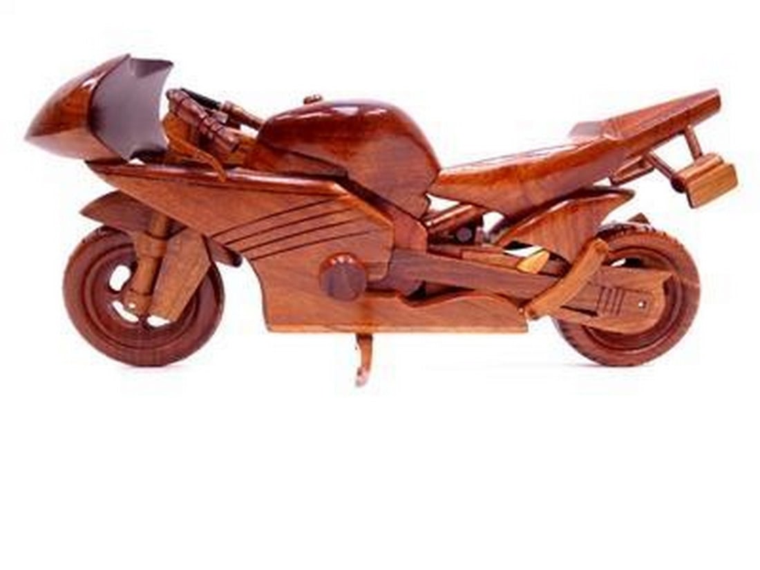 Racing Bike: Racing Bike This is handcrafted from mahogany with a working kickstand. This model is triple coated in high gloss polyurethane finish. Dimensions: 13'' Long x 4'' Wide x 7'' High View photos for