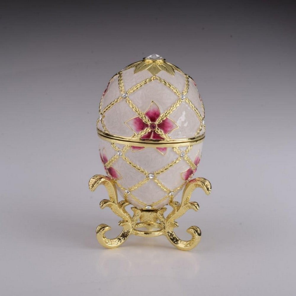 White Egg with Flowers & Harp: White Egg with Flowers & Harp Enamel painted trinket box decorated with austrian crystals. A splendid handmade white russian Egg with flowers and harp surprise inside trinket box. This piece is a uniq