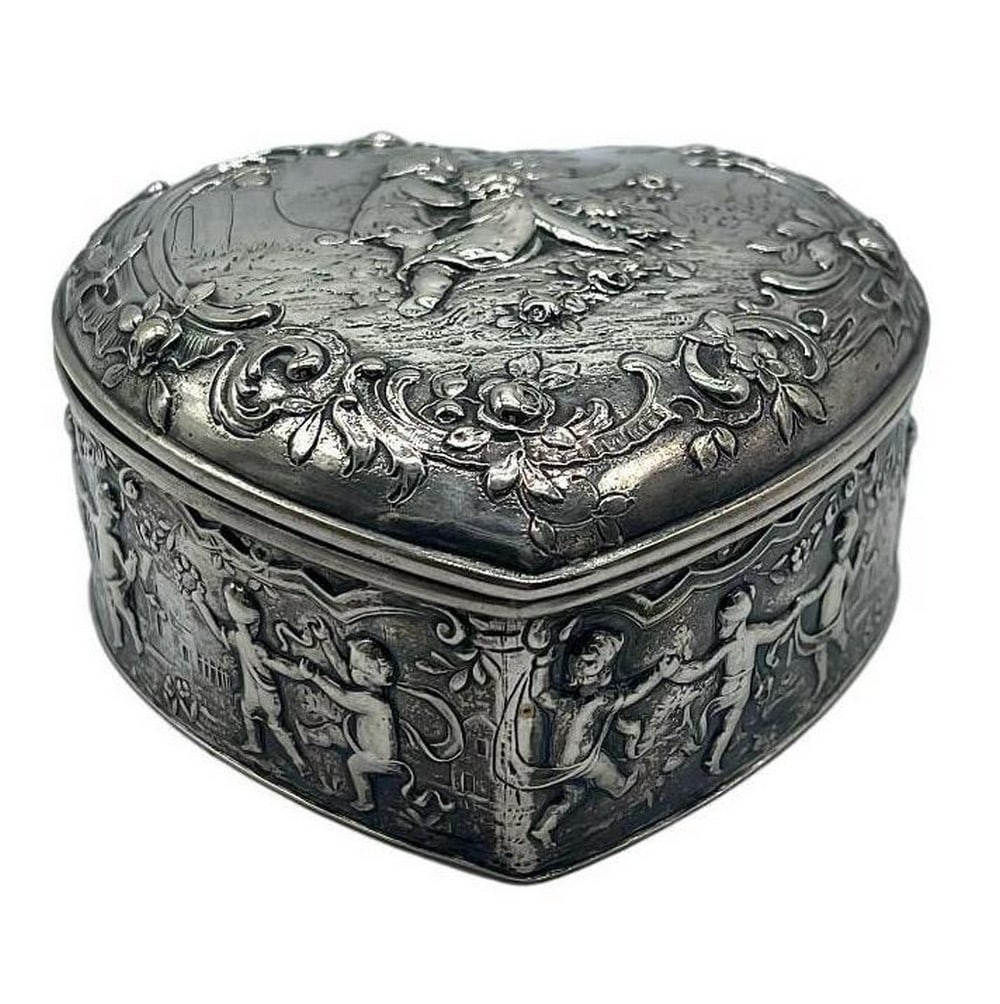 Vintage Cupid Heart Sterling Silver Trinket Box 4'' x 4'' x 2'': Vintage Cupid Heart Sterling Silver Trinket Box 4" x 4" x 2" Embrace the enduring symbol of love with our Vintage Cupid Heart Sterling Silver Trinket Box. Its sterling silver heart exterior,